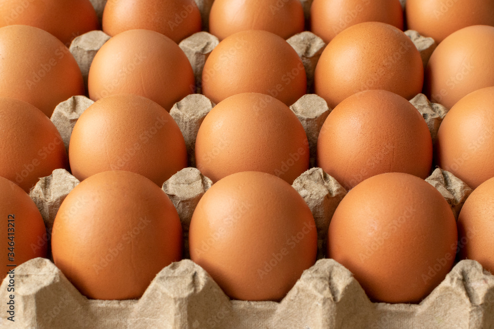 Brown egg in paper packaging. Container for eggs. Recycling. Healthy rustic breakfast Brown egg in paper packaging. Container for eggs. Recycling. Healthy rustic breakfast