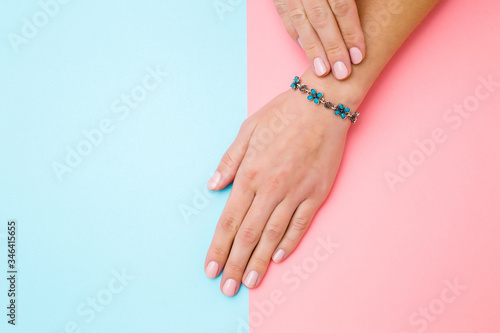 Obraz na płótnie Flower bracelet on young woman hand wrist