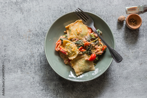 fresh Ravioli with tomato sauce on a dish top view