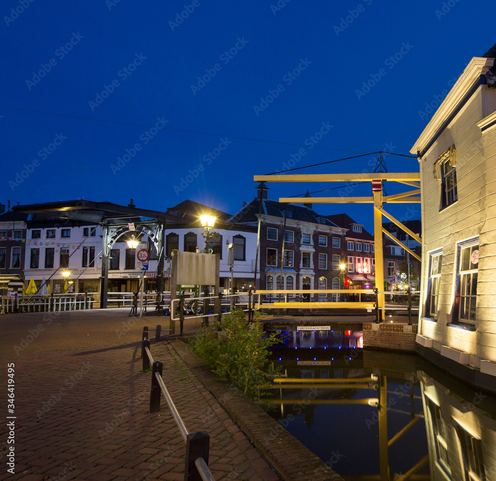 City of Schiedam at night. Twilight. Draw bridge and canal City of Schiedam at night. Twilight. Draw bridge and canal