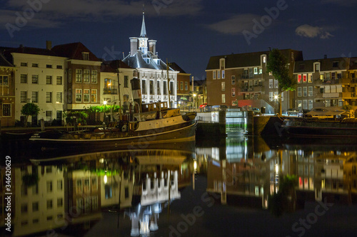 City of Schiedam at night. Twilight.Harbour and boats.