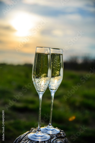  champagne glasses at sunset