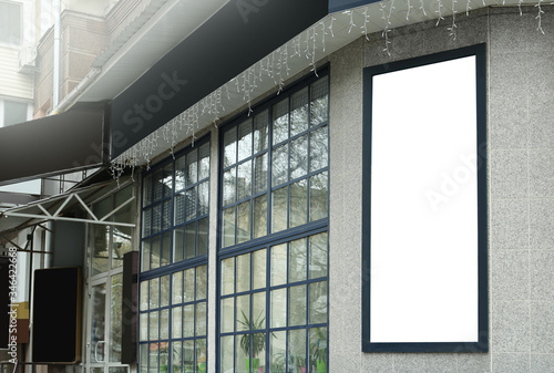 Blank banner on building facade outdoors. Advertising board design