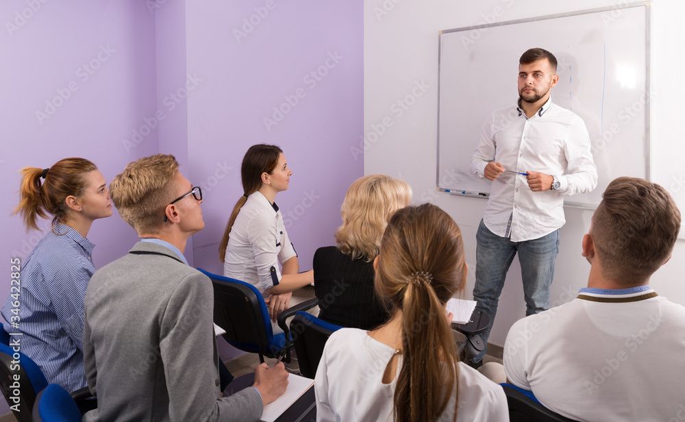 Fototapeta premium Group of smiling students at extension courses