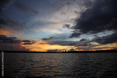 Landscape of Amazon jungle river during sunset  in Brazil © CYSUN