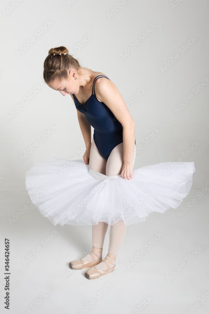 Young ballerina preparing for dance in the studio Young ballerina preparing for dance in the studio