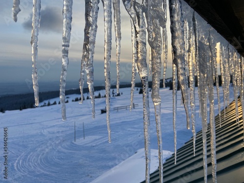 icicles on the roof of a house
