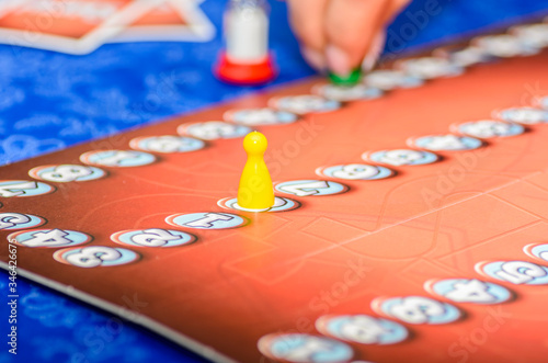 Woman plays a board game during the self-isolation mode