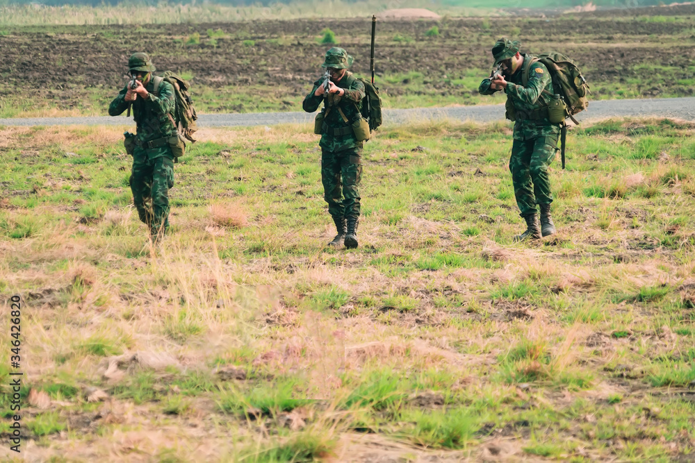 soldier with a rifle.Army soldier in protective uniform holding rifle .special forces soldier assault rifle with silencer. Sniper in the forest. soldier with a rifle.Army soldier in protective uniform holding rifle .special forces soldier assault rifle with silencer. Sniper in the forest.