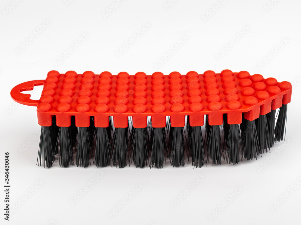 Fototapeta premium red brush for washing various surfaces with a plastic body and artificial bristles