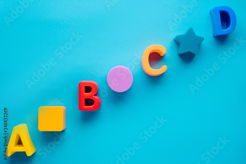 letters abcd on a blue background. layout. children's background
