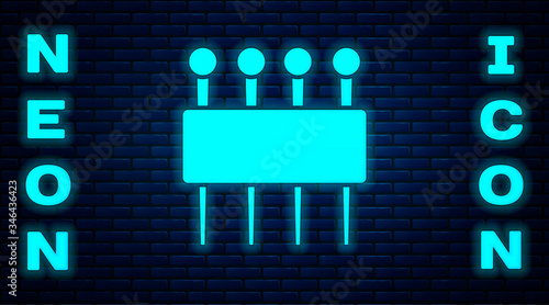 Glowing neon Needle for sewing icon isolated on brick wall background. Tailor symbol. Textile sew up craft sign. Embroidery tool. Vector Illustration