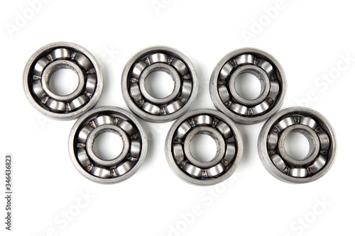 Top view Set of various metal rolling bearing spare part of mechanical on white background.