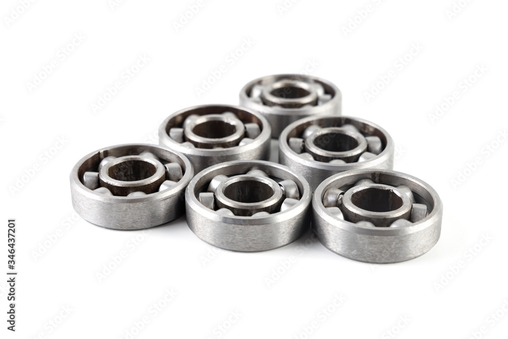 Set of various metal rolling bearing spare part of mechanical on white background. Set of various metal rolling bearing spare part of mechanical on white background.