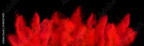 red holi paint color powder explosion isolated dark black background. industry beautiful party festival concept