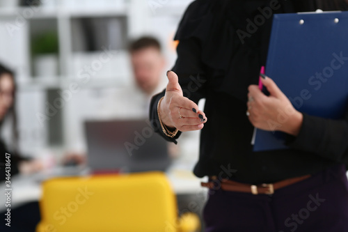 Woman hold document pad give arm as hello