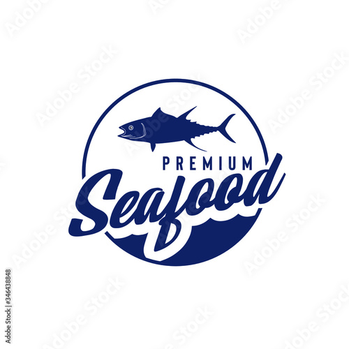 Vector logo illustration of fish silhouette and handwritten typography in circle frame isolated on white background suit for seafood restaurant logo