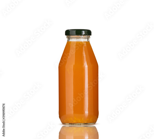 orange juice in glass bottle on white background