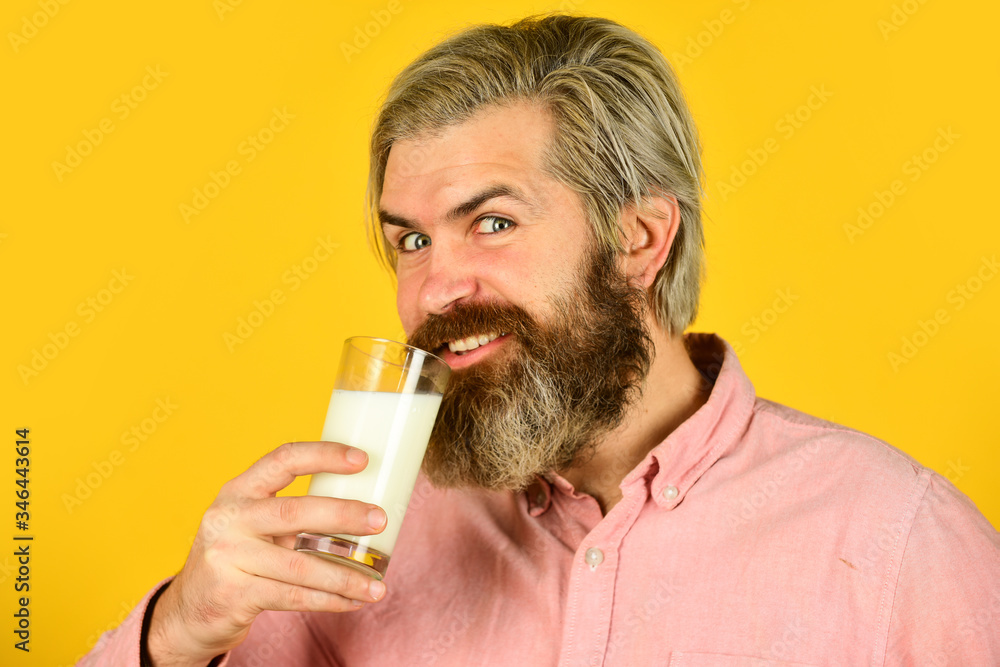 Emotional bearded man hold glass of milk. Vegan milk concept. Vegan milks made from wide variety of beans nut, seeds and grains. Healthy food. Drink protein cocktail. Lactose free. Pasteurized milk Emotional bearded man hold glass of milk. Vegan milk concept. Vegan milks made from wide variety of beans nut, seeds and grains. Healthy food. Drink protein cocktail. Lactose free. Pasteurized milk