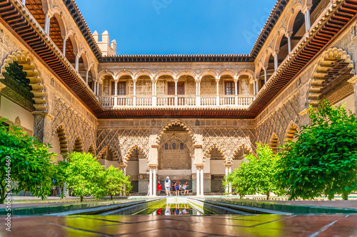 Moorish architecture of beautiful castle called Real Alcazar in Seville, Spain photo
