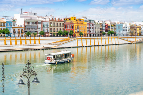 Boat cruise on Guadalquivir river in city center of Seville, Spain photo