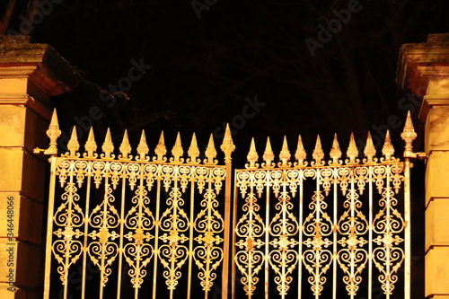 old wrought iron gate in night time