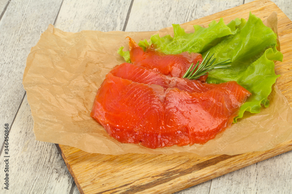 Sliced salmon fillet served rosemary Sliced salmon fillet served rosemary