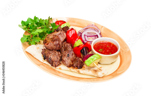 beef barbecue with vegetables  and sauce on plate,  isolated on white, food menu 