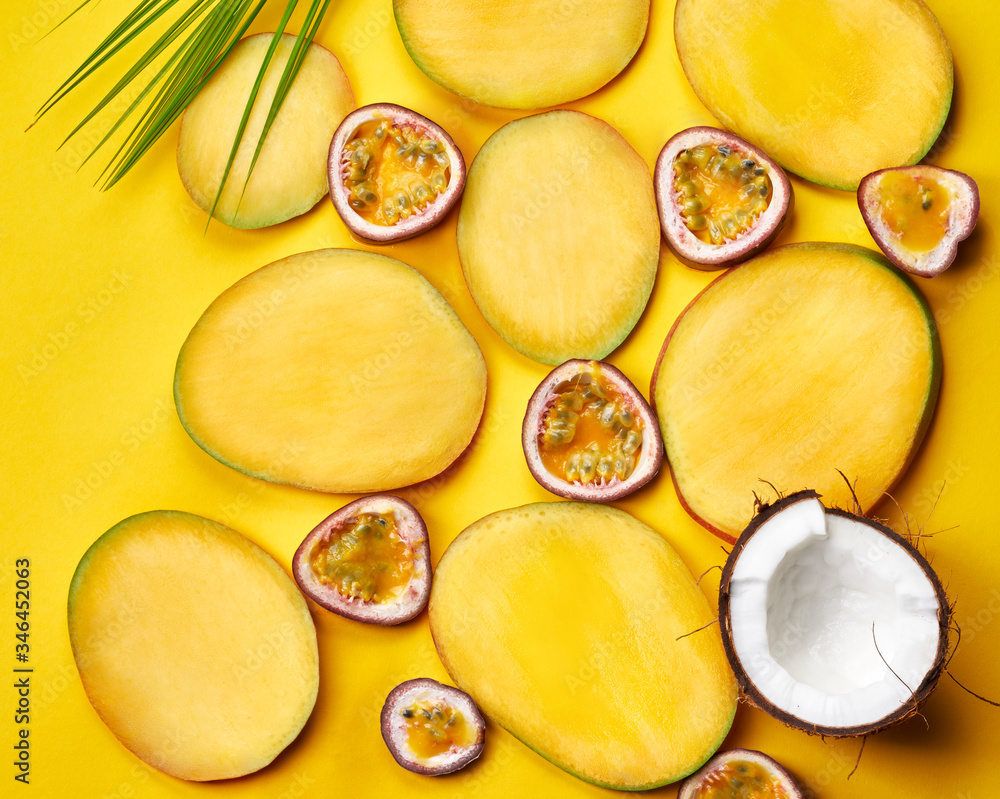 Flat lay of mango slices on yellow paper background Flat lay of mango slices on yellow paper background