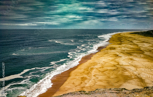 nazare potugal,playa norte,arena,mar photo