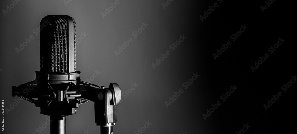 Professional studio microphone on dark background, audio recording banner,  podcast or music background Stock Photo | Adobe Stock
