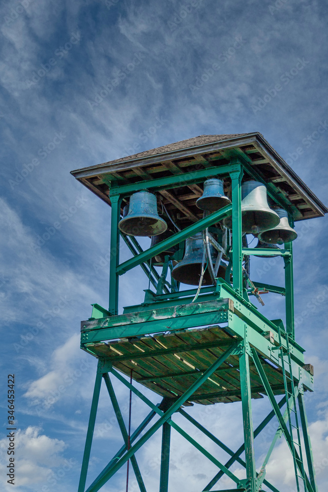 An old green tower in Bar Harbor with Church bells