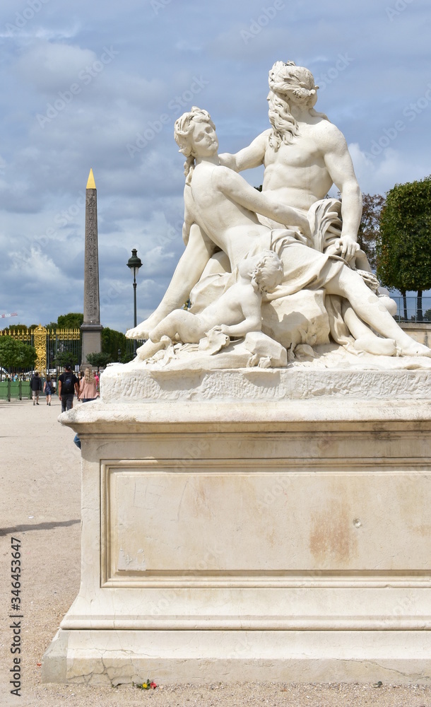 Copy of La Seine et la Marne 1712 statue, original by Nicolas Coustou (1658-1733), at Jardin des Tuileries with the Obelisque de Louxor. Paris, France. 