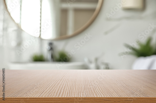 Фототапет Empty wooden table and blurred view of stylish bathroom interior