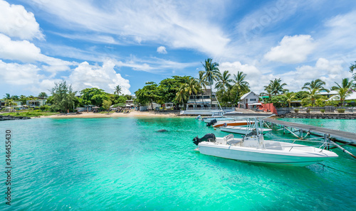 Landscape with turquoise  water amd speed boats in Mauritius island, Africa © Balate Dorin