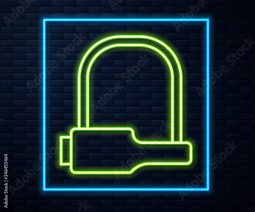 Glowing neon line Bicycle lock U shaped industrial icon isolated on brick wall background. Vector Illustration