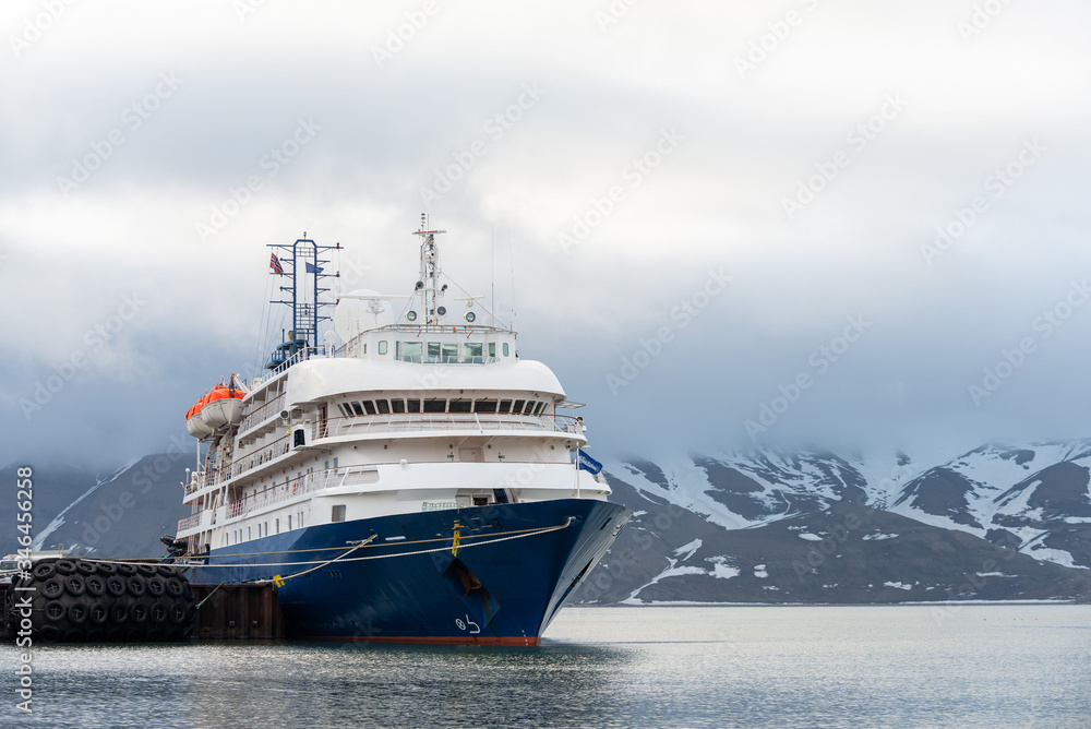 Passenger ship moored in port of Longyearbyen view from forward