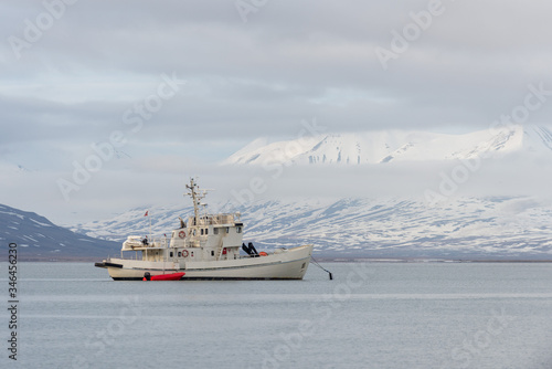 White fishing vessel at anchor