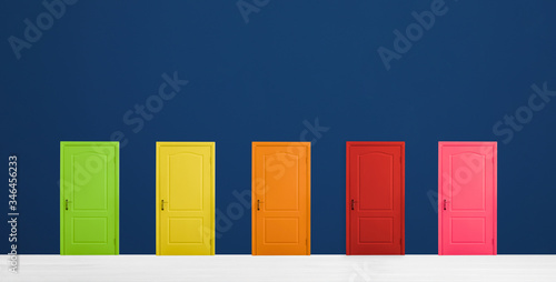 Many colorful doors in room. Concept of choice photo