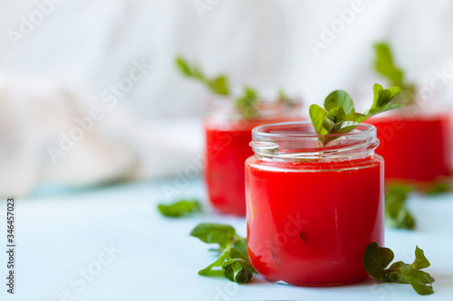 Wallpaper Mural Glasses of homemade cold juice with mint with fresh berries on a light background. Selective focus. Torontodigital.ca