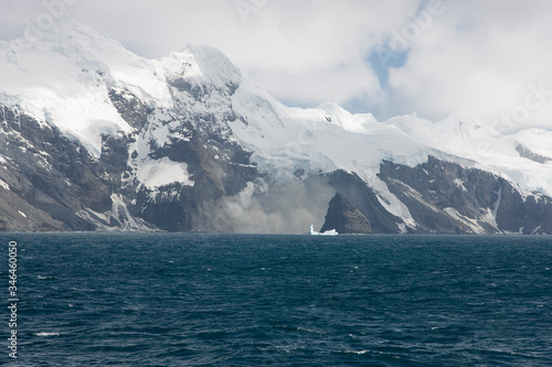 Antarctica landscape with ocean and mountains on a clear winter day