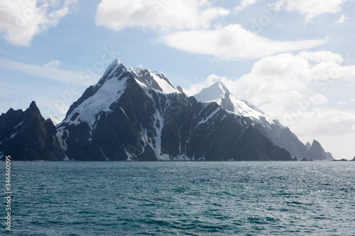 Antarctica landscape with ocean and mountains on a clear winter day