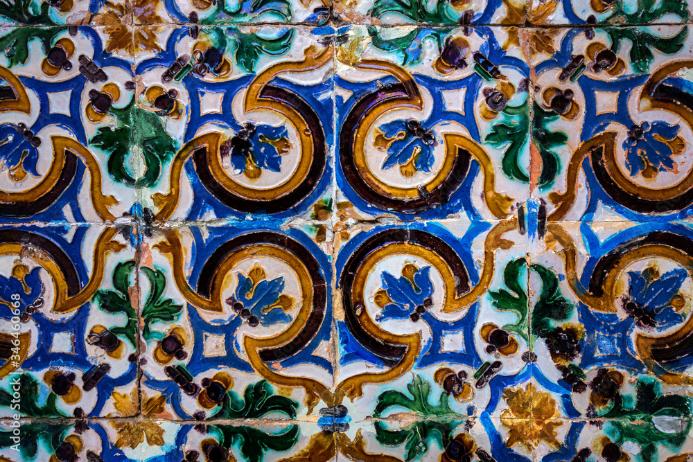 Traditional tiled wall decoration in a city palace in Seville, Spain