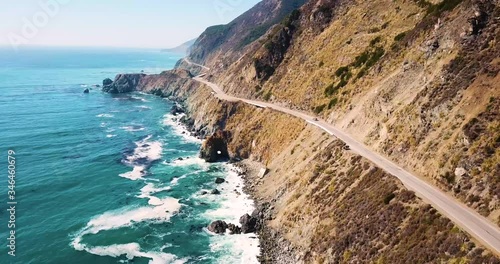 A car driving along the Pacific Highway coast. Aerial tracking shot photo