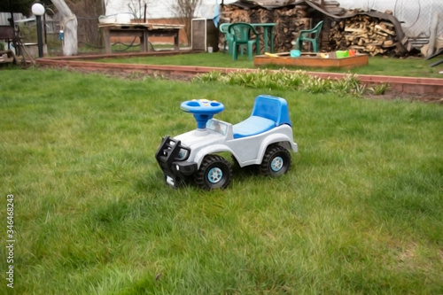 children car on green grass in the village