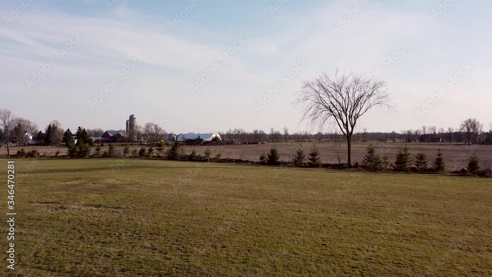 flat farmland with red barns and grain silo in dry nature, Chesterville, Canada flat farmland with red barns and grain silo in dry nature, Chesterville, Canada