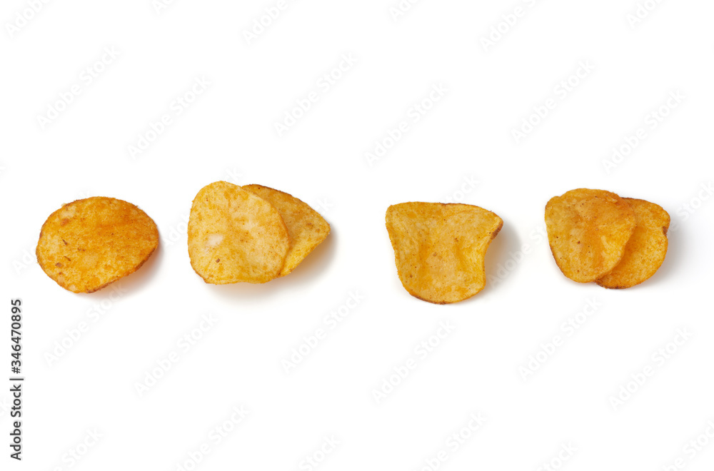 various potato chips with spice isolated on a white background various potato chips with spice isolated on a white background
