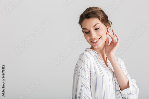 Image of cheerful nice woman smiling and posing on camera