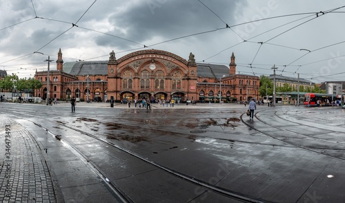 rainy day at train station with tram lines summer day