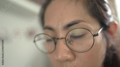 young woman with glasses working job at home